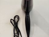 a hair dryer and a charger on a table