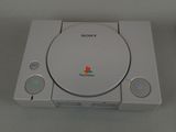the sony playstation classic console is sitting on a white surface