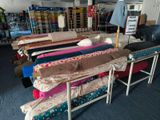 a lot of beds that are sitting in a room