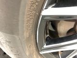 a close up of a car tire with a tire sticker on it