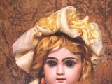 a book with a picture of a little girl wearing a hat