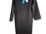 a black coat on a hanger with a tag on it