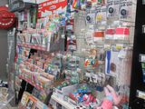 a large display of toys in a store with a red fire hydrant in the background