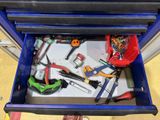 a blue tool chest with tools in it