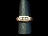 an image of a gold ring with two diamonds