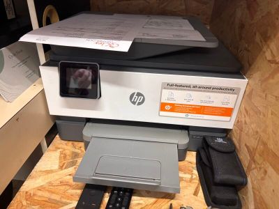 a printer sitting on top of a table with a printer on it