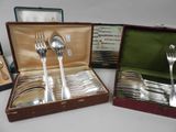 a box with silverware in it on a table