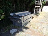 a pile of steel bars stacked on top of each other