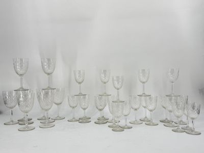 a lot of wine glasses sitting on a table