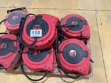 several red and black blowers sitting on top of a tile floor