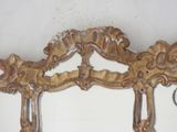 a mirror that is hanging on the wall in the room