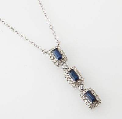 a sapphire and diamond pendant on a chain
