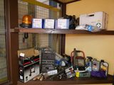a shelf with many electronics on it in a room