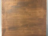an image of a piece of wood that has been painted with brown paint