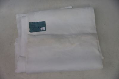 a piece of white cloth with a green tag on it