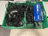 many wires in a green basket on the floor