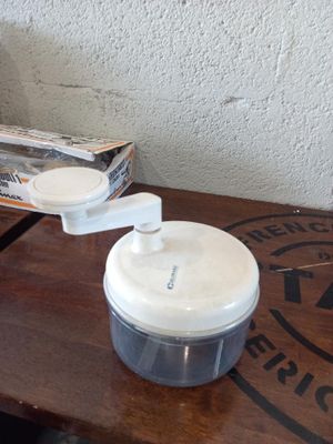 a blender sitting on a table with a box of food in front of it