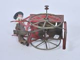 a toy of a man on a horse drawn carriage