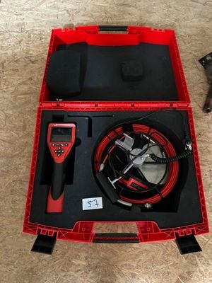 a red box with a black and red hose and a red box with a black hose and a red box with a black hose and a black hose