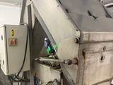 an image of a machine that is working on a piece of metal