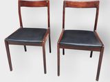 pair of danish teak dining chairs with black leather upholstered seats
