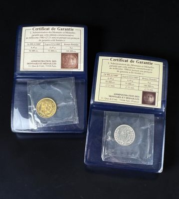 three different types of gold coins in plastic cases on a black surface
