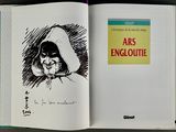 an open book with a drawing of a woman in a hoodie