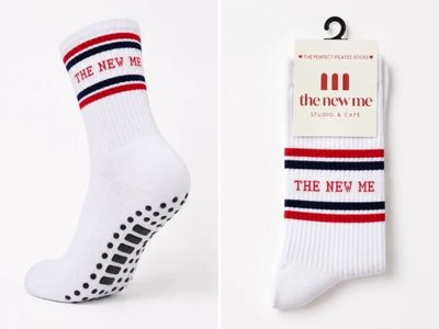 two pairs of socks with the new me logo on them