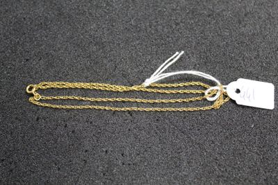 a gold chain with a tag attached to it