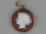 a picture of a picture of a woman ' s head in a pendant