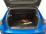 the trunk of a blue car with a power strip in the trunk