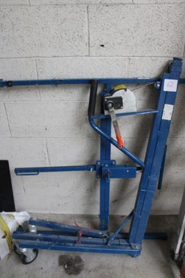 a picture of a blue lift in a garage
