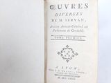 a book that is open on a white surface