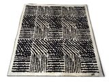 a black and white rug with a pattern on it