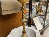 a statue of a bird on a pedestal in a store