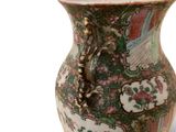 a vase that is sitting on a white surface