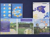 three books on a blue table with a map of europe and a map of europe