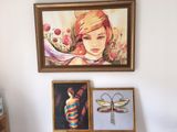 a painting of a girl and a dragonfly on the wall