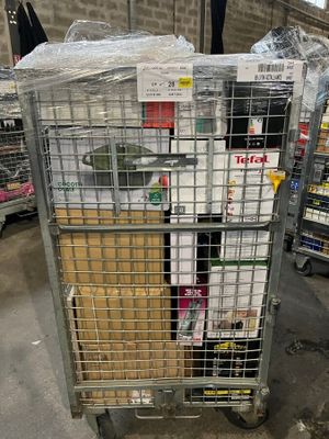a large metal cage with a bunch of boxes on top of it