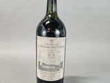 a bottle of wine that is sitting on a table