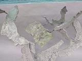 a glass table with a sculpture of a bird on it