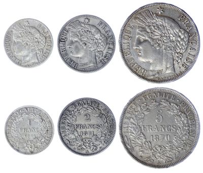 six different types of silver coins on a white background