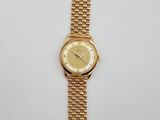 an image of a gold watch on a white surface