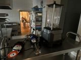 a blender sitting on top of a table in a kitchen