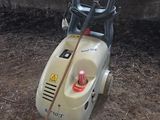 a moped that is sitting in the dirt