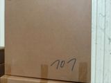 boxes are stacked on top of each other in a room