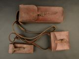 three pieces of leather luggage sitting next to each other on a table