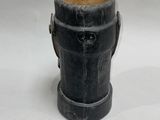 a black fire hydrant that is on a white surface