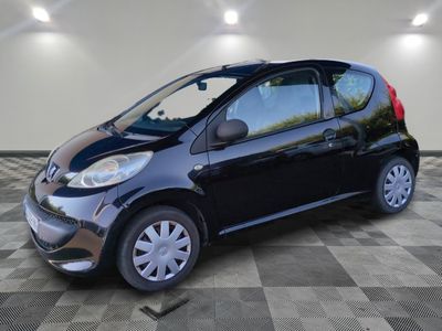 a picture of a small black car parked in a garage