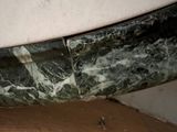 a close up view of a marble sink in a bathroom